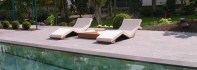 Pool Design. Outdoor pool - Floor in Natural Stone Basalt – Front view of the Infrared Heated Marble Loungers.jpg
